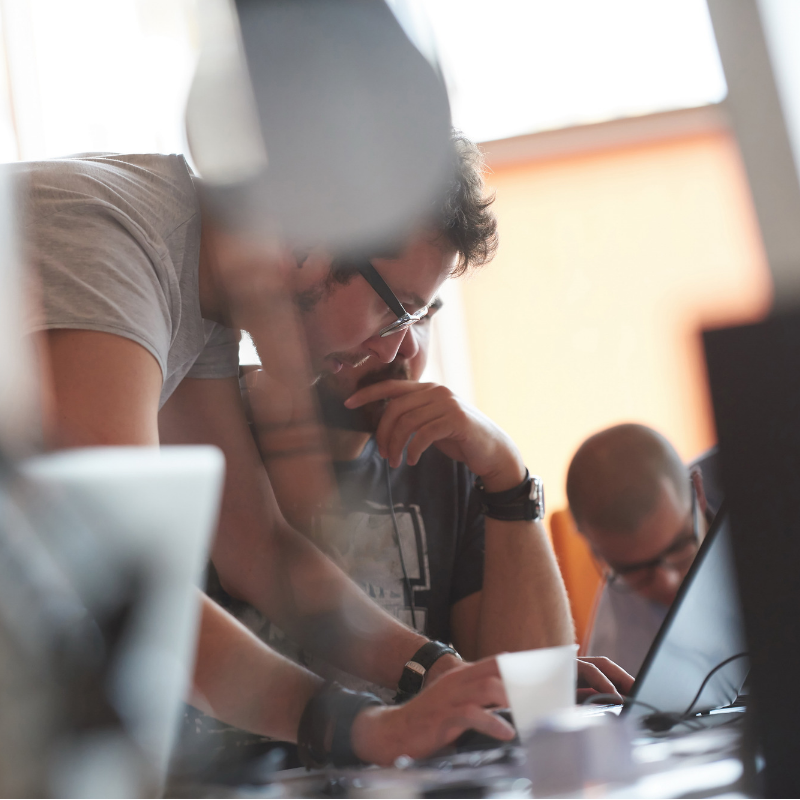 Office worker looking at a screen and pointing