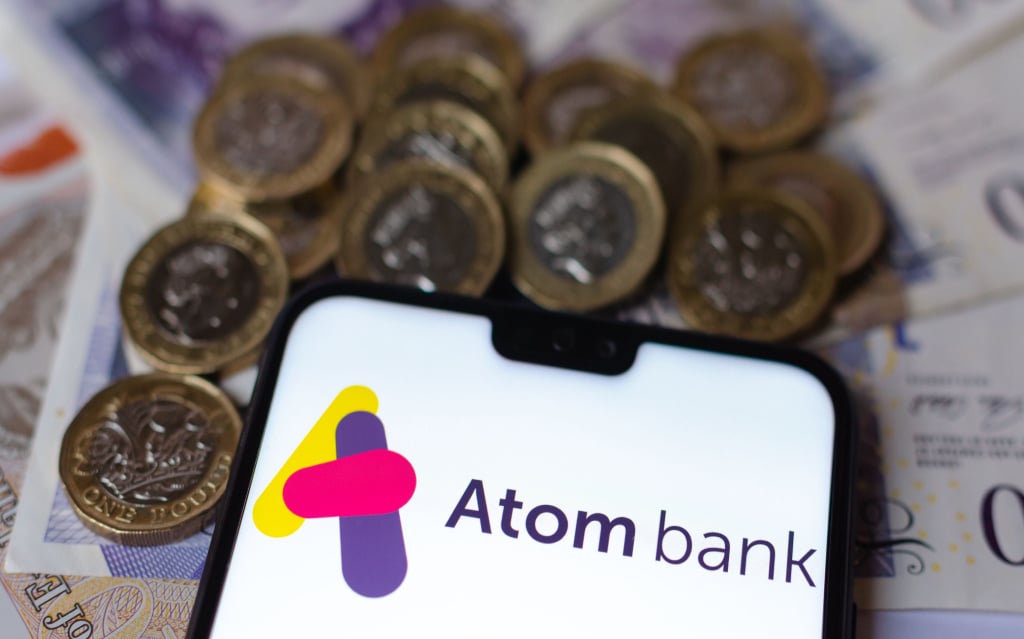 Smartphone screen showing Atom Bank page