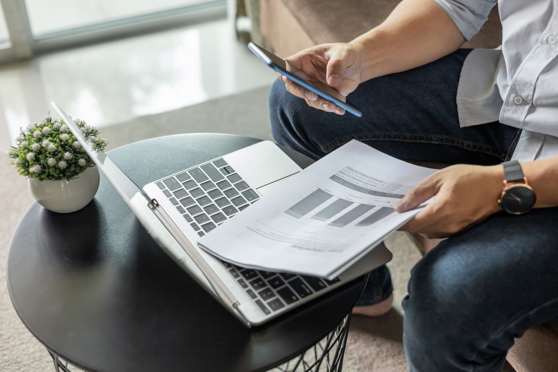 Man completing tax efficient investing review on laptop