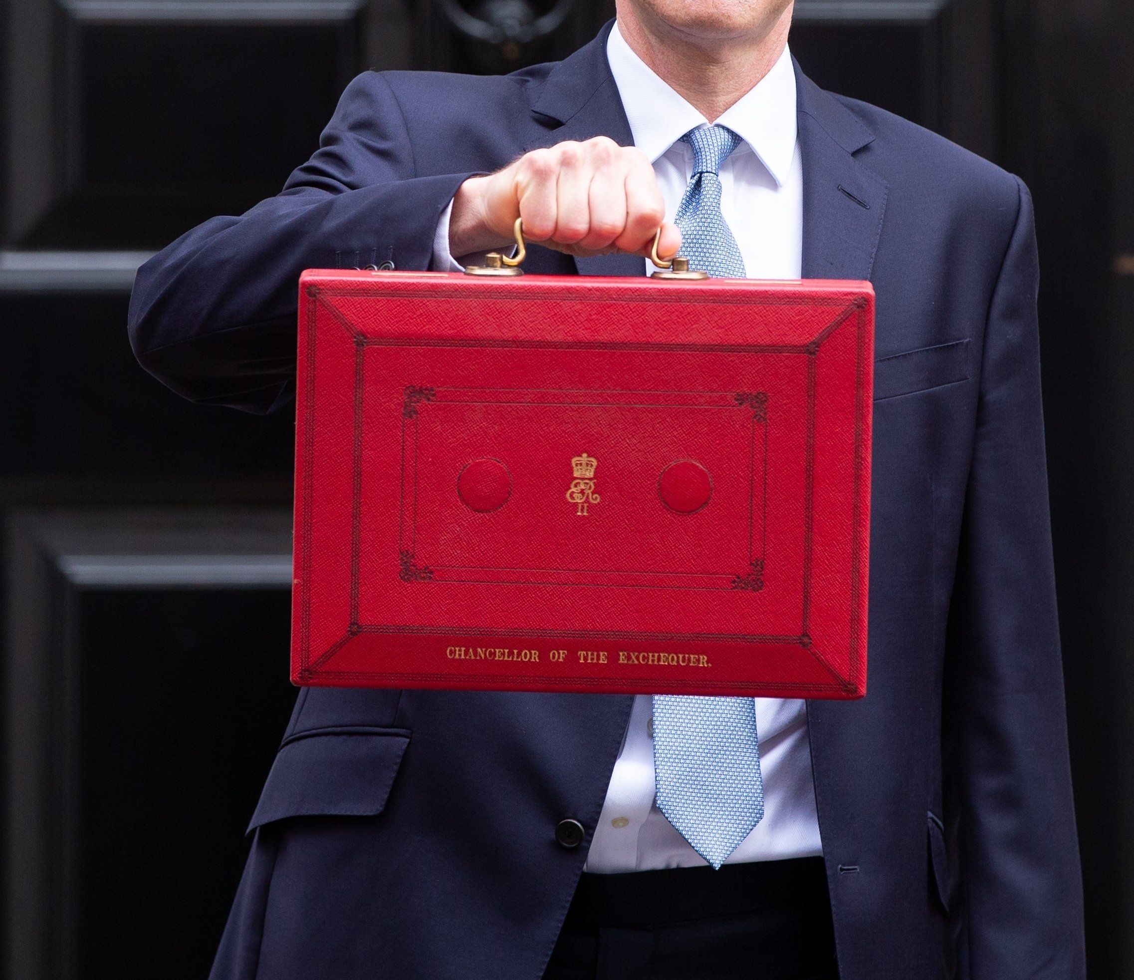 2023/24 Budget Jeremy Hunt with red suitcase 