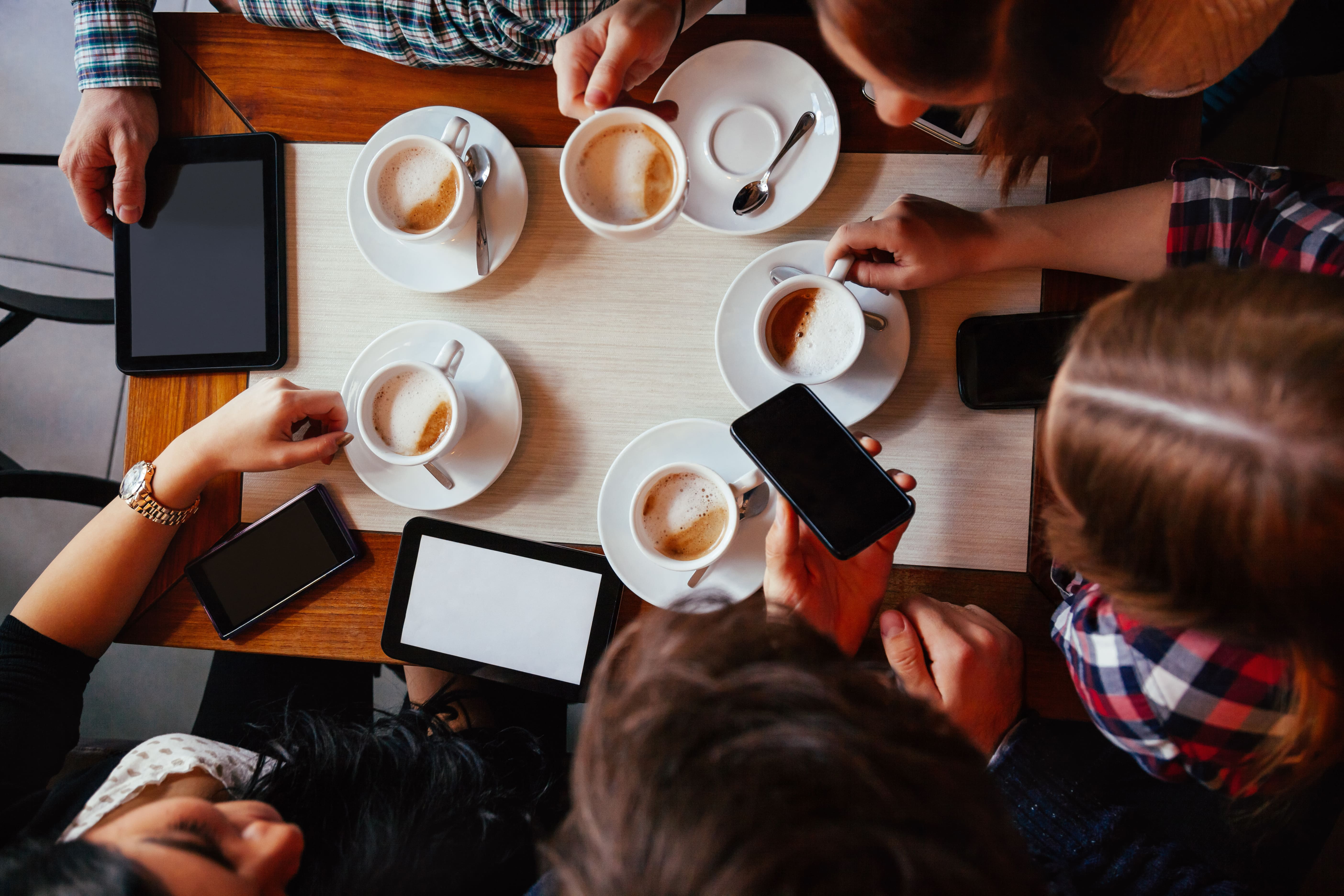 Coffee and smartphone meeting.