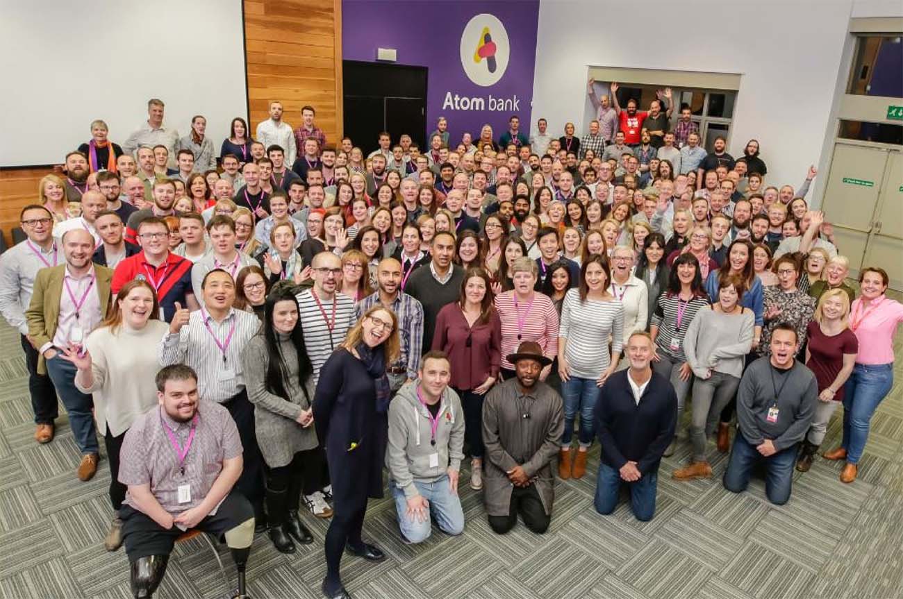 The Atom Bank team posing for a photo with Will I Am